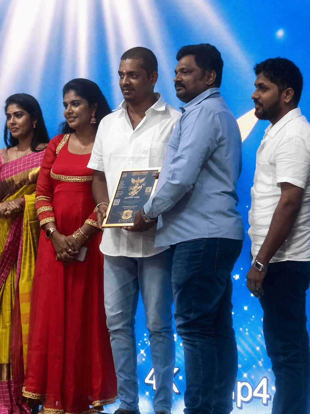 The CrystalPro team on stage receiving the Best Mobile App Development Company in Tamil Nadu recognition, presented by Honorable Tamil Nadu Minister K. Vignesh.