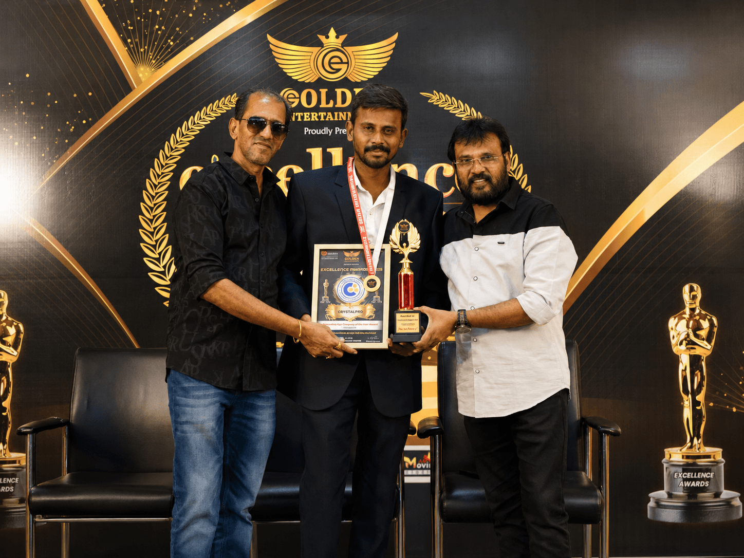 CrystalPro representatives on stage with Film Director Perarasu and actor Vaiyapuri, receiving the Best Mobile App Development Company in Coimbatore recognition.